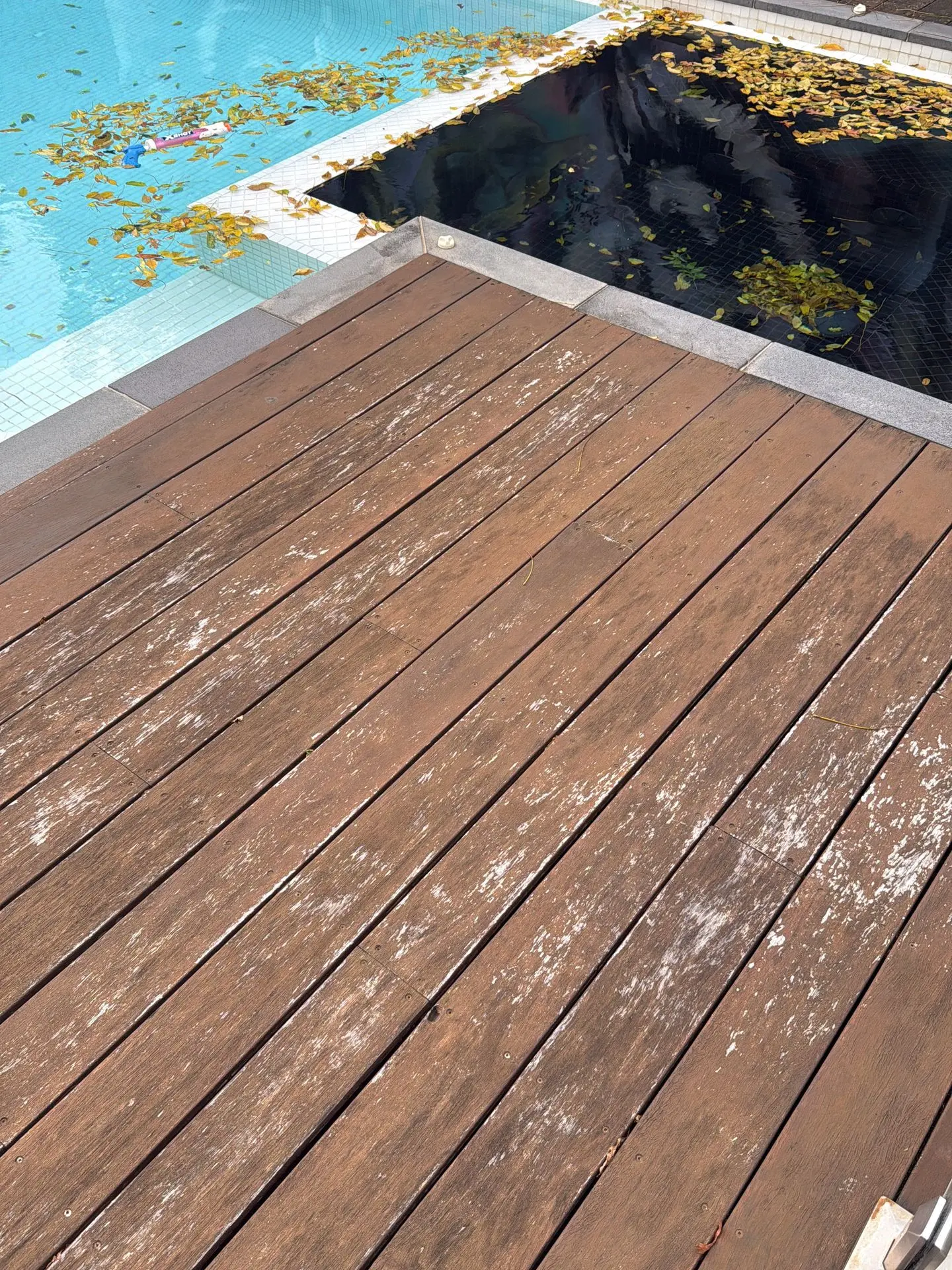 Previously coated peeling timber deck