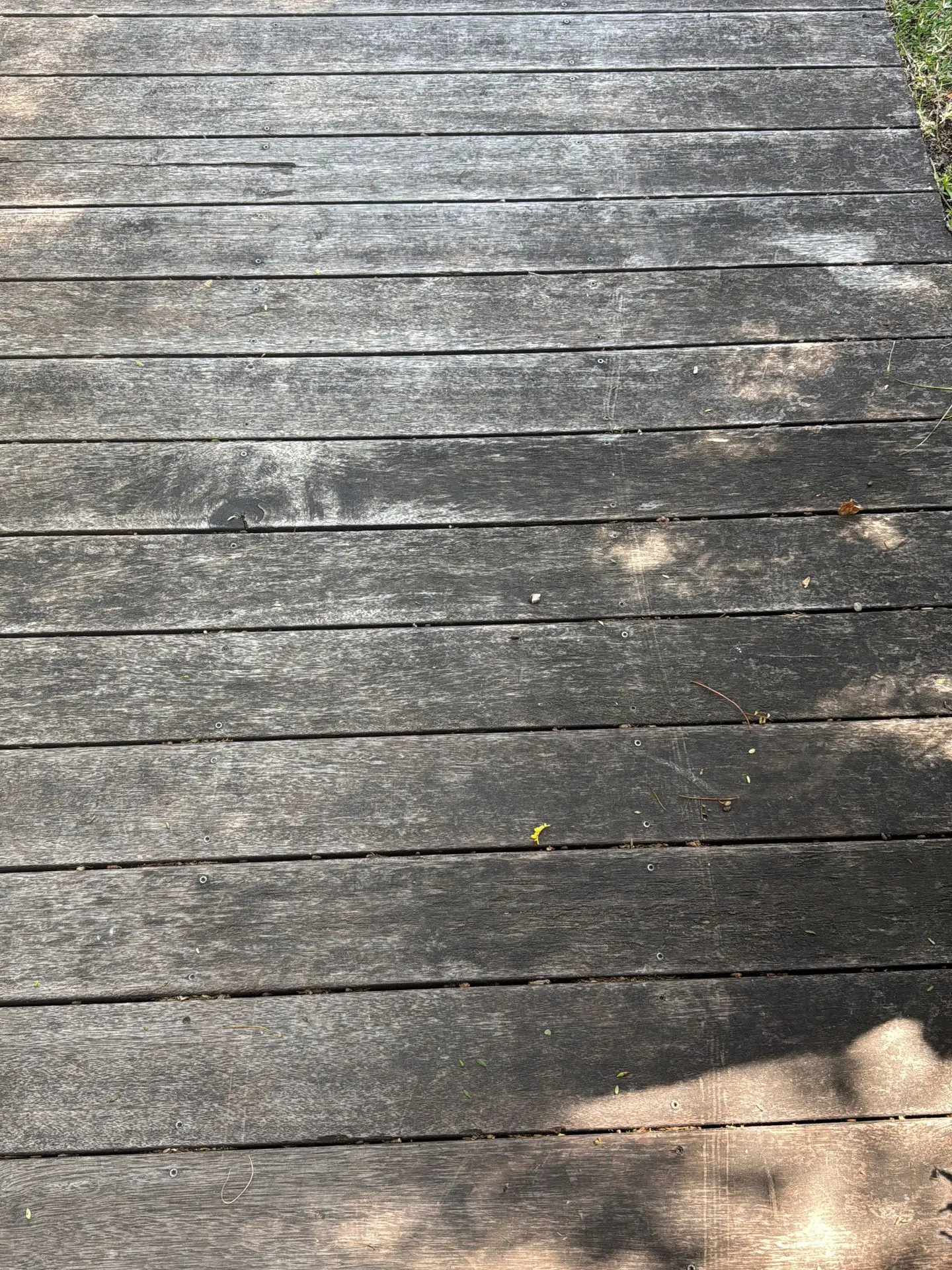Bare grey weathered timber deck